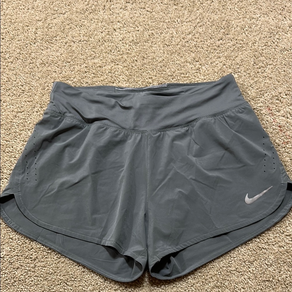 Nike Gray Athletic Shorts with Curved Hem and Elastic Waistband